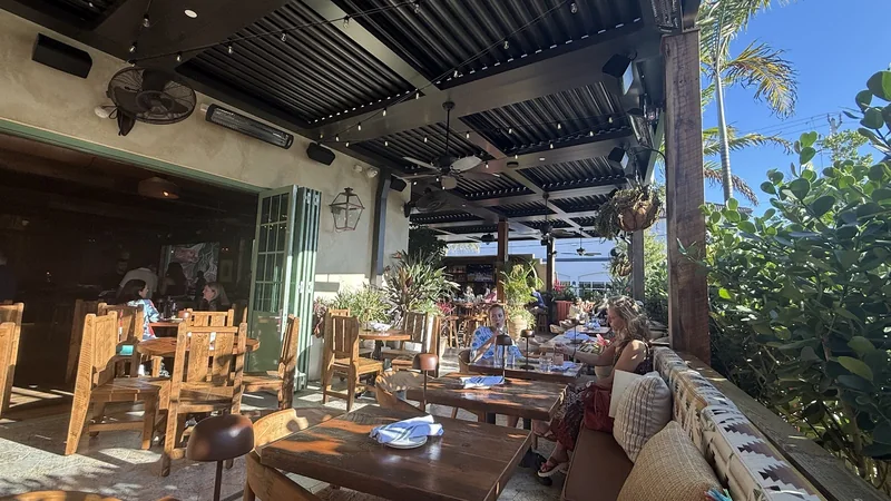 Loco Taqueria & Oyster Bar — bougainvillea-framed entrance